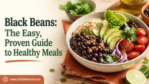 Bowl of cooked black beans topped with cilantro and lime on a rustic wooden table